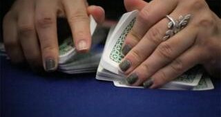 dealer shuffling cards
